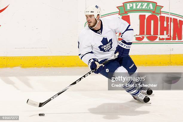 Ian White of the Toronto Maple Leafs skates with the puck against the Florida Panthers at the BankAtlantic Center on November 27, 2009 in Sunrise,...