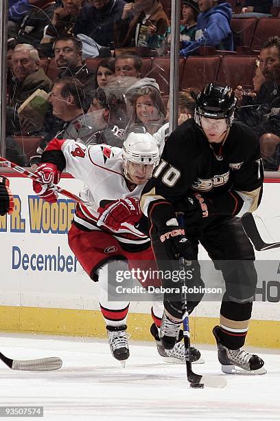 Sergei Samsonov of the Carolina Hurricanes chases after Corey Perry of the Anaheim Ducks as he handles the puck during the game on November 25, 2009...