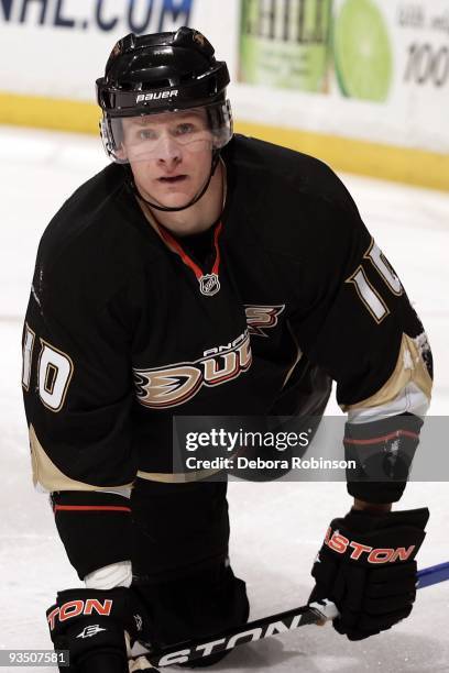 Corey Perry of the Anaheim Ducks falls to the ice behind the net during the game against the Carolina Hurricanes on November 25, 2009 at Honda Center...