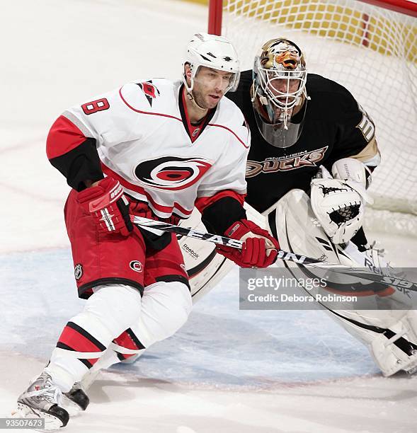 Matt Cullen of the Carolina Hurricanes defends in front of the crease against Jean-Sebastien Giguere of the Anaheim Ducks during the game on November...