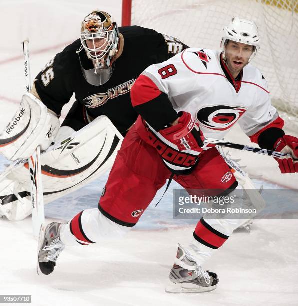 Matt Cullen of the Carolina Hurricanes defends outside the crease against Jean-Sebastien Giguere of the Anaheim Ducks during the game on November 25,...