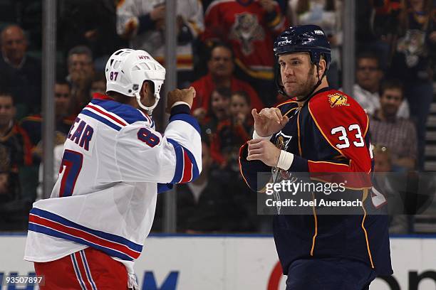 Steve Macintyre of the Florida Panthers faces off against Donald Brashear of the New York Rangers on November 25, 2009 at the BankAtlantic Center in...