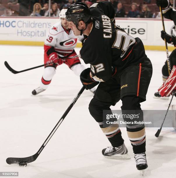 Kyle Calder of the Anaheim Ducks handles the puck during the game against the Carolina Hurricanes on November 25, 2009 at Honda Center in Anaheim,...