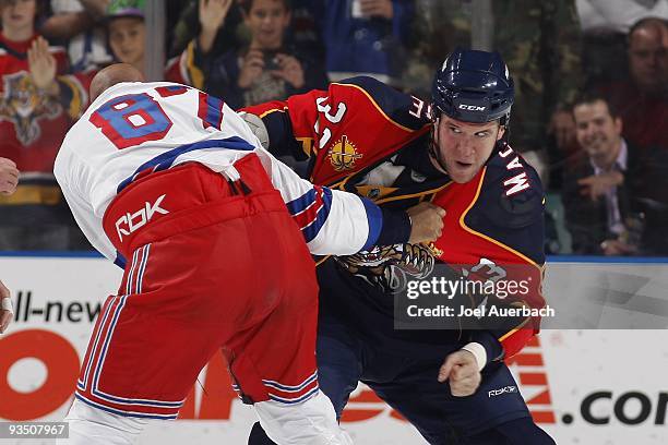 Steve Macintyre of the Florida Panthers fights with Donald Brashear of the New York Rangers on November 25, 2009 at the BankAtlantic Center in...