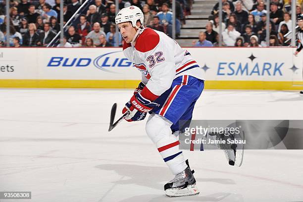 Forward Travis Moen of the Montreal Canadiens skates with the puck against the Pittsburgh Penguins on November 25, 2009 at Mellon Arena in...