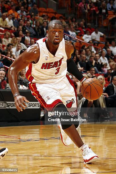 Dwyane Wade of the Miami Heat makes a move to the basket during the game against the New Jersey Nets at American Airlines Arena on November 14, 2009...