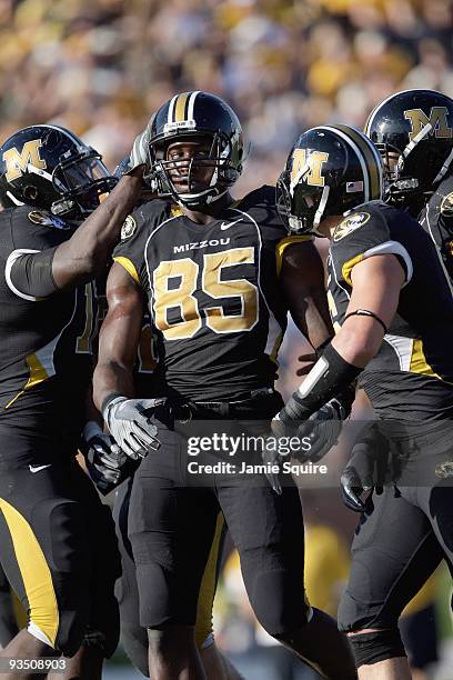 Aldon Smith of the Missouri Tigers is congratulated by teammates during the game against the Baylor Bears at Faurot Field/Memorial Stadium on...