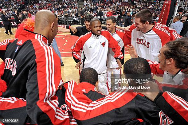 Taj Gibson, Lindsey Hunter, Brad Miller and Joakim Noah of the Chicago Bulls dance in the team huddle before the game against the Philadelphia 76ers...