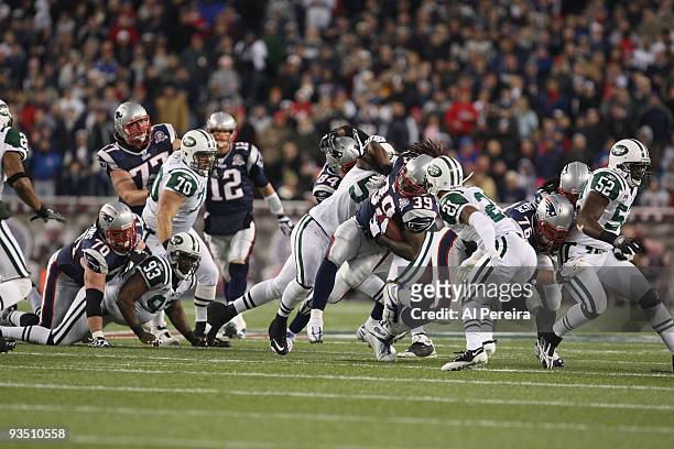 Running Back Laurence Maroney of the New England Patriots runs hard against the New York Jets when the New England Patriots host the New York Jets at...
