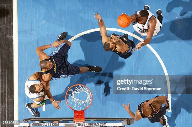 Ramon Sessions of the Minnesota Timberwolves shoots in the key against Malik Allen of the Denver Nuggets during the game on November 25, 2009 at the...