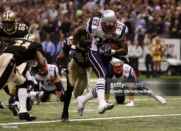 Laurence Maroney of the New England Patriots runs in for a touchdown in the first quarter of the game against the New Orleans Saints at Louisana...