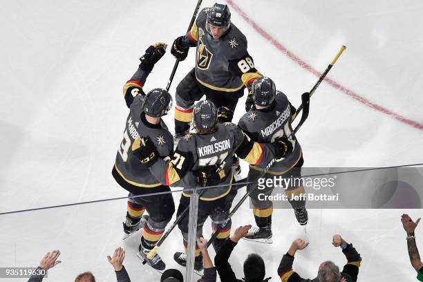 William Karlsson celebrates his goal with teammates Brayden McNabb, Nate Schmidt and Jonathan Marchessault of the Vegas Golden Knights against the...