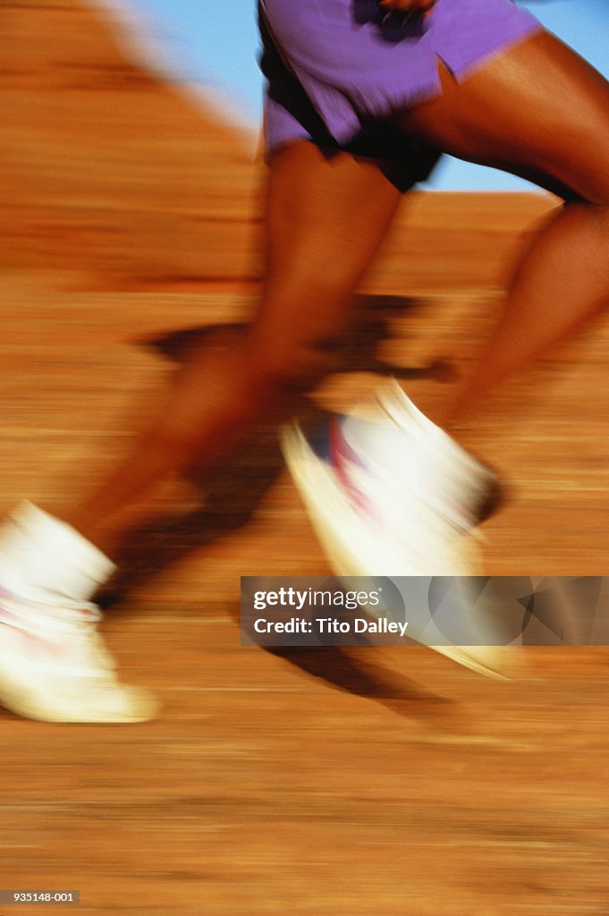 Runner's legs, close-up (blurred motion)