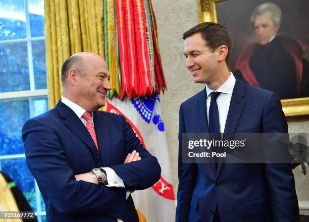 Outgoing White House Chief Economic Adviser Gary Cohn talks to White House Advisor Jared Kushner, as they attend a meeting with President Donald...