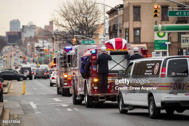 Members of the New York City fire department escort the casket of firefighter Thomas Phelan down 4th Avenue before heading to St. Michael's Church in...