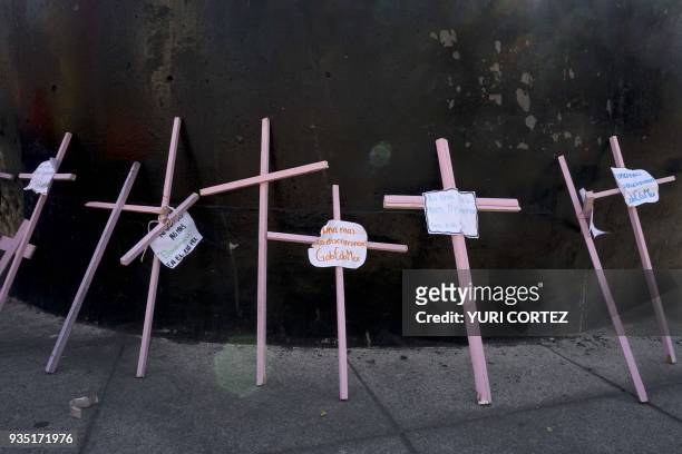 Pink crosses remain at the foot of a monument on Reforma Avenue in Mexico City as a protest against feminicides in the state of Mexico, on March 20,...