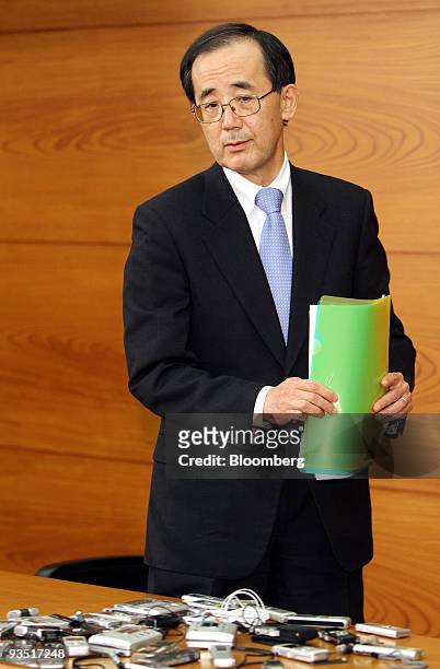 Masaaki Shirakawa, governor of the Bank of Japan, leaves a news conference in Tokyo, Japan, on Tuesday, Dec. 1, 2009. The Bank of Japan said it will...