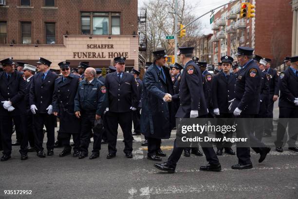 Members of the New York City Fire Department arrive for the funeral of firefighter Thomas Phelan outside St. Michael's Church in the Sunset Park...