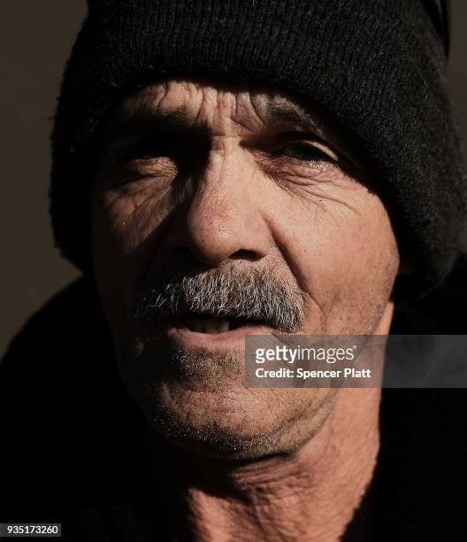 Norman waits outside of a soup kitchen in an economically stressed section of the city on March 20, 2018 in Worcester, Massachusetts. Worcester, once...