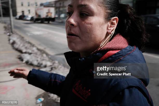 Blanca, who struggles with addiction, pauses in an economically stressed section of the city on March 20, 2018 in Worcester, Massachusetts....