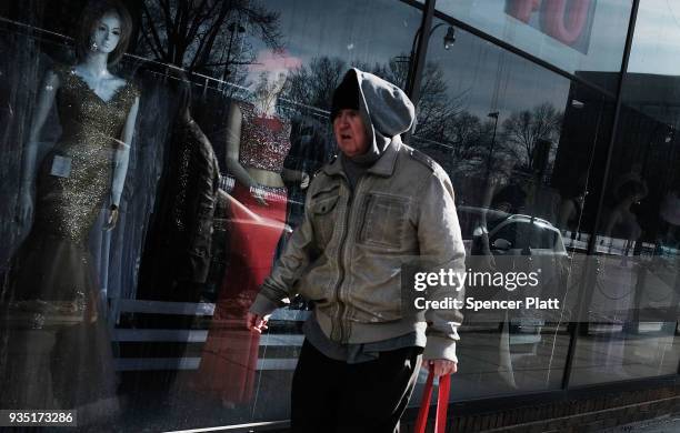 Man walks through an economically stressed section of the city on March 20, 2018 in Worcester, Massachusetts. Worcester, once a thriving...