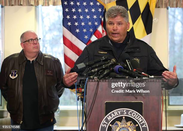 St. Mary's Sheriff Timothy Cameron is flanked by Maryland Governor Larry Hogan, , as he briefs the media about a shooting this morning at Great Mills...