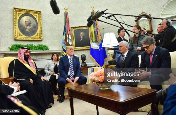 President Donald Trump, center, speaks while Mohammed bin Salman, Saudi Arabia's crown prince, left, listens during a meeting in the Oval Office of...