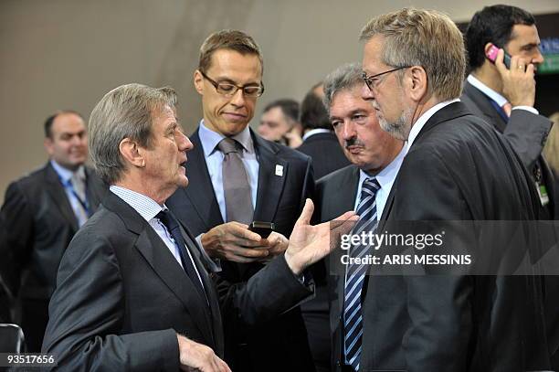 French Foreign Minister Bernard Kouchner speaks with his Luxembourgian counterpart Jean Asselborn and Danish Per Stig Moeller as Finnish Foreign...