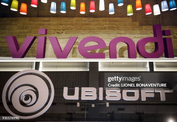 Combination of files pictures made March 20 shows on the top, the French media group Vivendi logo on April 24 in Paris, and the French video game...