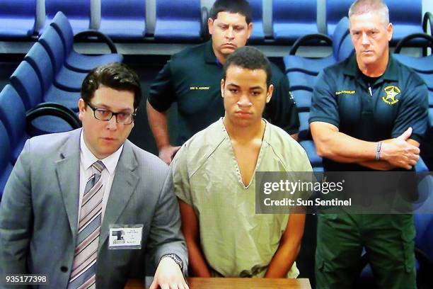 Zachary Cruz appears in court via CCTV from the main jail for his first appearance on charges of trespassing on the grounds of Marjory Stoneman...