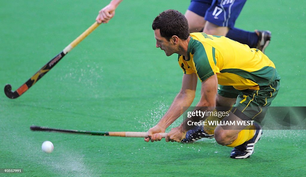 Australian player Jamie Dwyer attempts a