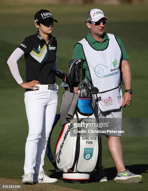 Sung Hyun Park of South Korea stands with her bag and caddie during the third round of the Bank Of Hope Founders Cup at Wildfire Golf Club on March...