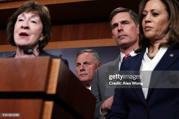 Sen. Susan Collins speaks as Chairman of Senate Intelligence Committee Sen. Richard Burr , Sen. Martin Heinrich , and Sen. Kamala Harris listen...