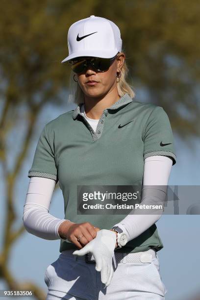 Michelle Wie puts on her gloves during the third round of the Bank Of Hope Founders Cup at Wildfire Golf Club on March 17, 2018 in Phoenix, Arizona.