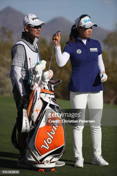 Chella Choi of South Korea takes a club from her bag during the third round of the Bank Of Hope Founders Cup at Wildfire Golf Club on March 17, 2018...