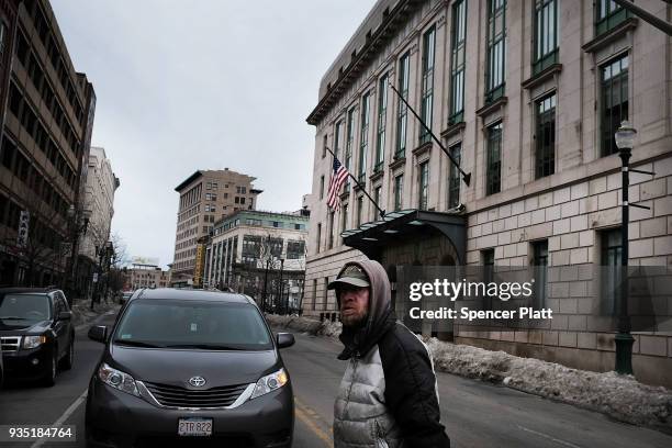 Man walks through an economically stressed section of the city on March 20, 2018 in Worcester, Massachusetts. Worcester, once a thriving...