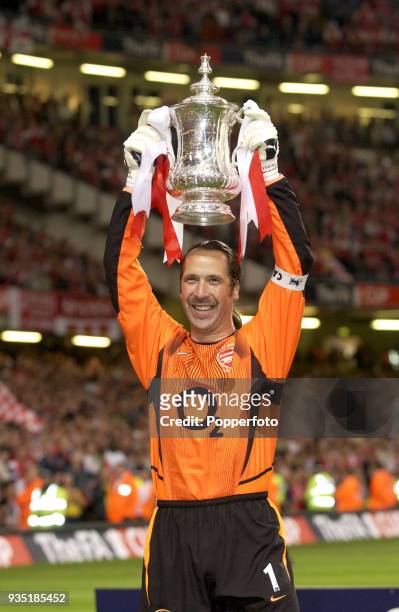 Arsenal captain and goalkeeper David Seaman lifts the FA Cup following their 1-0 victory over Southampton in the FA Cup Final between Arsenal and...