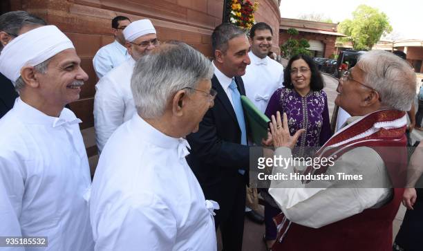 Senior BJP leader M M Joshi poses with a group of Parsi community people on the eve of their new year, at Parliament House during Budget Session in...