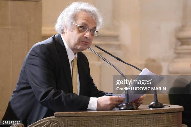 French writer and academician Amin Maalouf speaks during a ceremony at the French Institute on March 20, 2018 in Paris after French President...