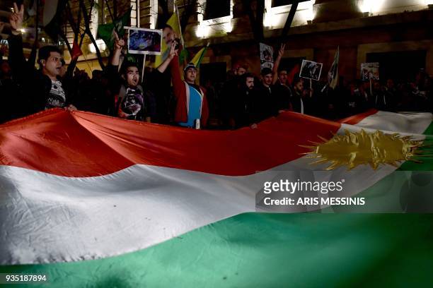 Members of the Kurdish minority in Greece protest outside the Turkish consulate in central Athens agaist Turkey's invasion to the Syrian city of...