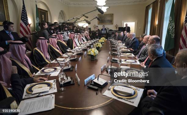 President Donald Trump, center right, speaks while Mohammed bin Salman, Saudi Arabia's crown prince, center left, listens during a working lunch in...