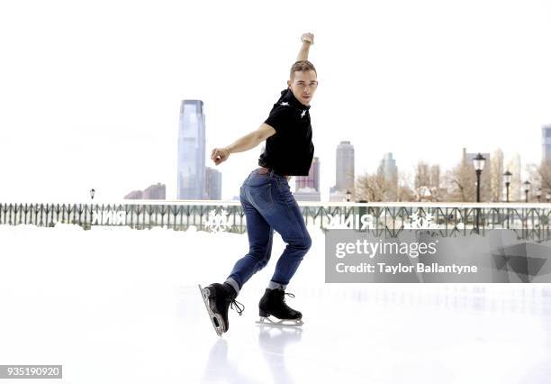 Portrait of Team USA Adam Rippon posing on the ice during photo shoot at The Rink at Brookfield Place. Rippon won a bronze medal in the Team event at...