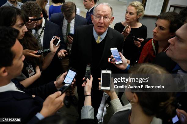 Sen. Lamar Alexander speaks with reporters ahead of the weekly policy luncheons on Capitol Hill March 20, 2018 in Washington, DC. Congress faces a...