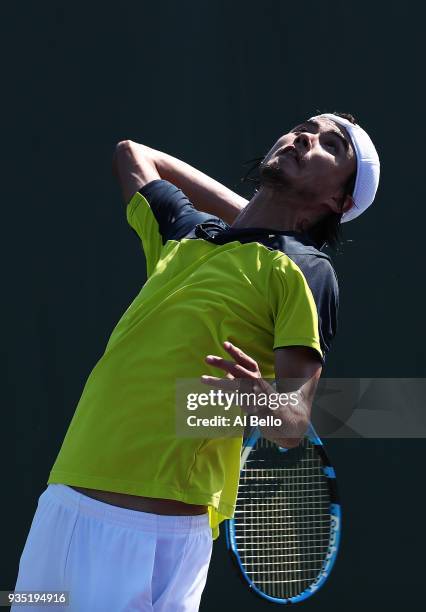 Daniel Taro of Japan serves to Thanasi Kokkinakis of Australia during Day 2 of the Miami Open at the Crandon Park Tennis Center on March 19, 2018 in...