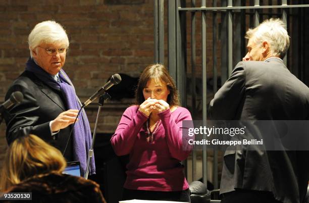 Amanda Knox's mother Edda Haff stands between her daughter's defence lawyers Luciano Ghirga and Carlo Della Vedova during the Meredith Kercher murder...