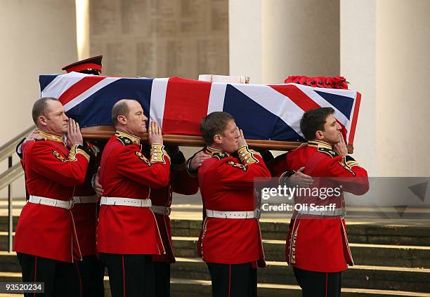 The coffin of Warrant Officer Class One Regimental Sergeant Major Darren Chant of the Genadier Guards is carried into the Guards Chapel on the...