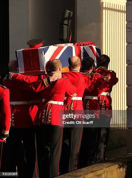 The coffin of Warrant Officer Class One Regimental Sergeant Major Darren Chant of the Genadier Guards is carried into the Guards Chapel on the...