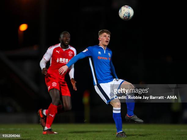 Toumani Diagouraga of Fleetwood Town and Andy Cannon of Rochdale during the Sky Bet League One match between Rochdale and Fleetwood Town at Spotland...