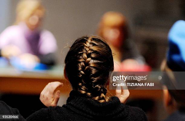 Student Amanda Knox, accused of taking part in the killing of her British roommate Meredith Kercher, sits during a trial session on December 1, 2009...