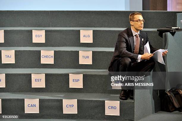 This picture taken on December 1, 2009 shows Finland's Foreign Minister Alexander Stubb waiting in his position prior to posing for a family photo...